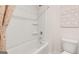 Bathroom featuring a white tub, shower combo, neutral walls and decor at 362 Friendship Oak Way, Hampton, GA 30228
