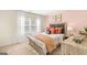 Cozy bedroom featuring neutral walls, a decorative headboard and bedside tables at 362 Friendship Oak Way, Hampton, GA 30228