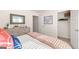 Bedroom with natural light, dresser, stylish mirror, and walk in closet at 362 Friendship Oak Way, Hampton, GA 30228