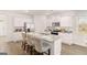 Well-equipped eat-in kitchen boasts stainless appliances and a granite topped kitchen island at 362 Friendship Oak Way, Hampton, GA 30228