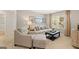 Comfortable living room with neutral tones, contemporary decor, and lots of natural light at 362 Friendship Oak Way, Hampton, GA 30228