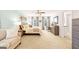 Spacious main bedroom featuring a king bed, neutral walls, large windows, and plush carpet at 362 Friendship Oak Way, Hampton, GA 30228