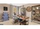 Home office with stylish desk, shelving units, and large windows providing ample natural light at 362 Friendship Oak Way, Hampton, GA 30228