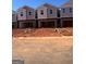 New construction townhomes feature attached garages and modern design elements at 11565 Kimberly Way # 24, Hampton, GA 30228
