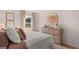 Cozy bedroom with a plush bed and natural light from the window at 358 Friendship Oak Way, Hampton, GA 30228