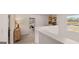 Bright hallway leads to a cozy home office area, complete with natural light and modern decor at 358 Friendship Oak Way, Hampton, GA 30228