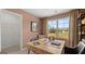 Well-lit home office features a large desk, comfortable seating, and ample space for work at 358 Friendship Oak Way, Hampton, GA 30228