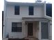 Exterior of the townhome with a white brick facade and modern windows at 746 Dunaire Way, Jonesboro, GA 30238