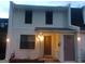 Two story townhome featuring a front door and a covered front entry at 746 Dunaire Way, Jonesboro, GA 30238