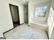 Bathroom features soaking tub, walk-in shower and walk-in closet at 6159 Sable Fox Dr, Riverdale, GA 30296