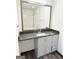 Bathroom featuring large vanity with grey granite counter top, under mount sink and grey cabinets at 6159 Sable Fox Dr, Riverdale, GA 30296