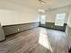 Bright dining room with wainscoting, modern lighting, and large windows, perfect for Gathering dinners and gatherings at 6159 Sable Fox Dr, Riverdale, GA 30296