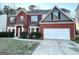 Charming two-story brick home with a well-maintained lawn and a two-car garage, offering great curb appeal at 6159 Sable Fox Dr, Riverdale, GA 30296