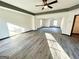 Bright living room with neutral walls, gray trim and gray-toned flooring illuminated by natural light at 6159 Sable Fox Dr, Riverdale, GA 30296