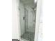 Updated tiled shower with glass door and mosaic tile shower floor at 6159 Sable Fox Dr, Riverdale, GA 30296