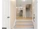 Inviting foyer with a staircase and wood floors, leading to other rooms of the home at 105 Queens Gate, Fayetteville, GA 30215