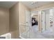 Upper level hallway leads to bedrooms, featuring neutral colors, offering a serene and private space at 105 Queens Gate, Fayetteville, GA 30215