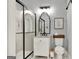 A charming bathroom with white subway tile in the shower and hexagon marble tile flooring at 340 Cedar St, Social Circle, GA 30025