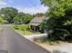 Cozy home on a peaceful street with mature trees and a lush lawn at 340 Cedar St, Social Circle, GA 30025