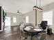 Inviting living and dining areas feature tile floors, recessed lights, and a gray sectional sofa at 340 Cedar St, Social Circle, GA 30025