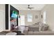 Cozy living room with a fireplace, large sectional sofa, and a mounted television for comfortable relaxation at 340 Cedar St, Social Circle, GA 30025