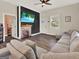 Relaxing living room boasts tile floors, a fireplace, and a comfy sectional sofa for modern living at 340 Cedar St, Social Circle, GA 30025