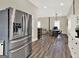 Bright and airy living and dining space with modern stainless appliances for seamless entertaining at 340 Cedar St, Social Circle, GA 30025