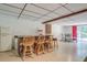 View of a finished basement space with a wet bar, table, and chairs at 677 Gum Creek Rd, Oxford, GA 30054