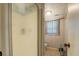 Bathroom with shower stall and window showing toilet and storage rack at 677 Gum Creek Rd, Oxford, GA 30054