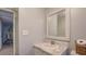 Bathroom featuring a vanity, faucet, and light blue wall with a mirror at 677 Gum Creek Rd, Oxford, GA 30054