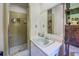 Full bathroom featuring a single sink, shower and built-in shelving at 677 Gum Creek Rd, Oxford, GA 30054