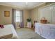 Bedroom featuring a window with purple curtains and access to a closet at 677 Gum Creek Rd, Oxford, GA 30054