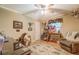 Bedroom with ceiling fan, natural light, wood floors, and neutral decor at 677 Gum Creek Rd, Oxford, GA 30054