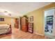 Yellow bedroom featuring a built-in dresser and a door to the bathroom at 677 Gum Creek Rd, Oxford, GA 30054