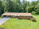 A cozy ranch-style home on a sprawling lawn, complete with an attached carport at 677 Gum Creek Rd, Oxford, GA 30054