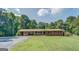 Charming single-story brick home with a carport and well-manicured lawn at 677 Gum Creek Rd, Oxford, GA 30054