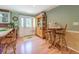 Eat-in kitchen with wooden breakfast bar, dining table, and access to the back yard at 677 Gum Creek Rd, Oxford, GA 30054
