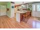 Charming kitchen with breakfast bar seating, brick accents, and bright natural light at 677 Gum Creek Rd, Oxford, GA 30054
