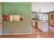 Bright kitchen partially visible showcasing the eat in breakfast area and brick accent wall at 677 Gum Creek Rd, Oxford, GA 30054