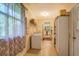Spacious laundry room with washer, dryer, and storage at 677 Gum Creek Rd, Oxford, GA 30054