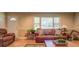 Cozy living room features natural light, hardwood floors and comfortable leather furniture at 677 Gum Creek Rd, Oxford, GA 30054
