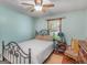 Charming bedroom features a decorative metal bed frame and light blue walls, creating a relaxing atmosphere at 2643 Rocky Creek Rd, Hampton, GA 30228