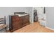 Bedroom closet and dresser featuring hardwood floors and neutral walls at 2643 Rocky Creek Rd, Hampton, GA 30228