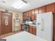 Charming kitchen featuring wood cabinets, stainless steel appliances, and a bright, clean ambiance at 2643 Rocky Creek Rd, Hampton, GA 30228