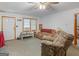A casual living room area with basic furniture and a view of the front door at 2643 Rocky Creek Rd, Hampton, GA 30228