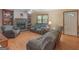 Spacious living room featuring wood floors and a stone fireplace at 2643 Rocky Creek Rd, Hampton, GA 30228