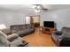 Comfortable living room with wood-look floors and neutral walls at 2643 Rocky Creek Rd, Hampton, GA 30228