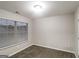 Bedroom featuring carpeted floor, neutral walls, and window with blinds for natural light at 323 Lauren Dr, Fairburn, GA 30213