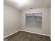 Bedroom with carpeted floor, neutral walls, and window with blinds for natural light at 323 Lauren Dr, Fairburn, GA 30213