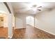 Inviting living area boasts wood-look floors, arched doorways offering sightlines to dining and other spaces at 323 Lauren Dr, Fairburn, GA 30213